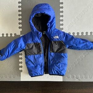 Blue and black infant north face jacket